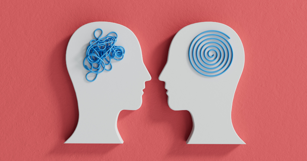 Two graphics of heads facing one another. Head on left has squiggle graphics inside and head on right has swirled graphic inside.