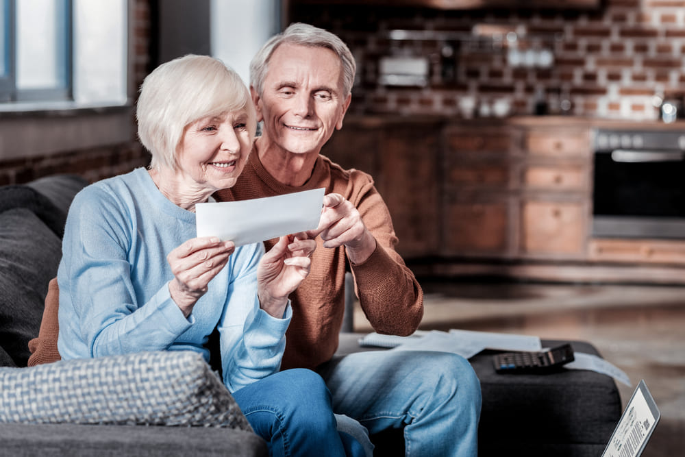 Retired couple learning how to maximize their social security benefits