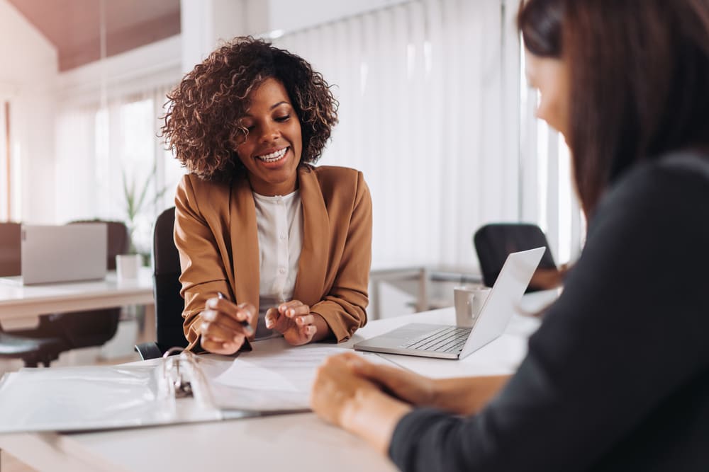 Lady sitting down to talk to a financial advisor