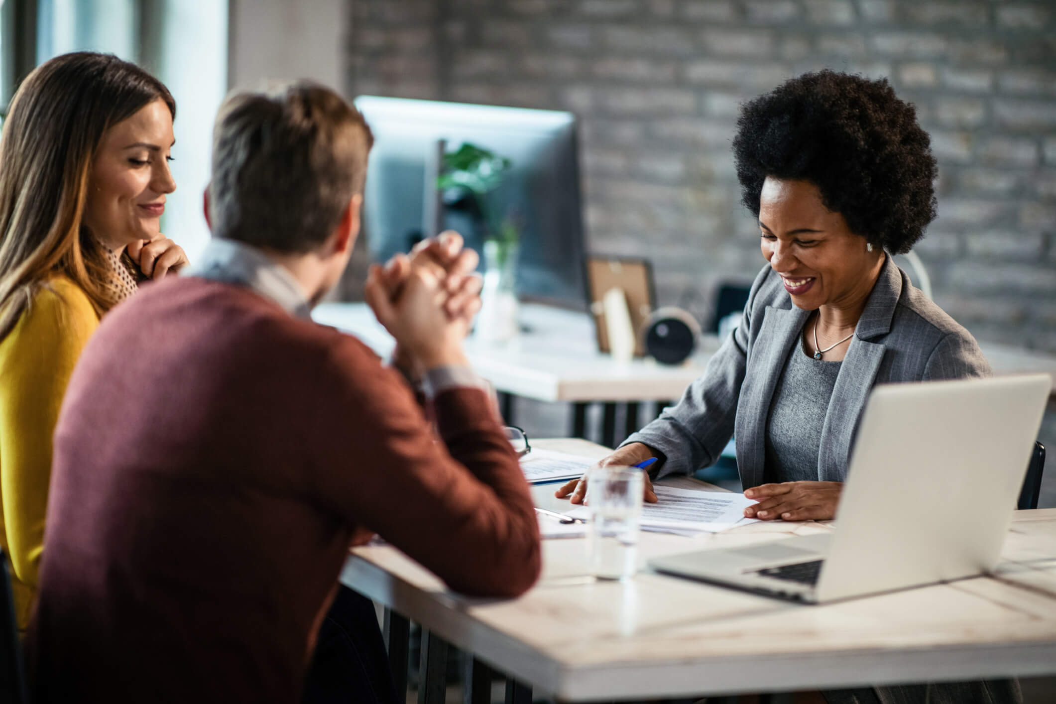 african-american-financial-advisor-meeting-couple